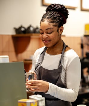 Young lady in the process of making a caffe